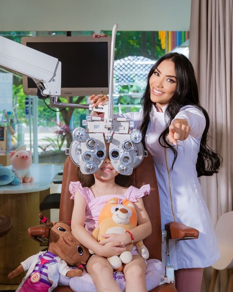 Female optometrist performing eye exam on young child using phoropter equipment in bright clinical setting